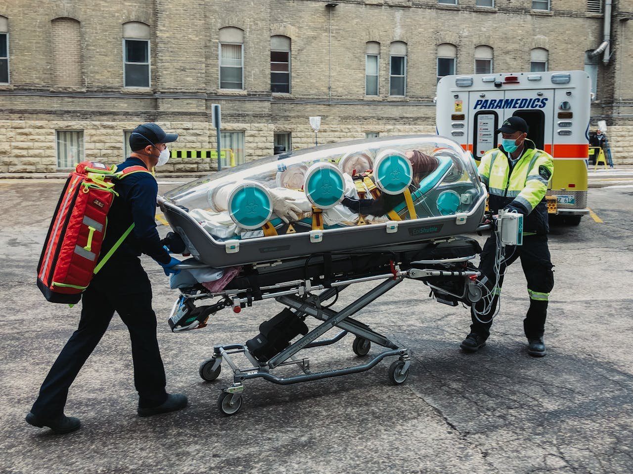 Paramedics Transporting a Patient Using an Epiguard Isolation Pod